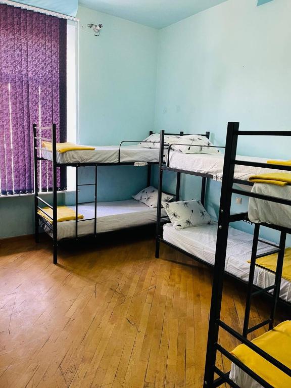 Postel nebo postele na pokoji v ubytování Olympic Hostel