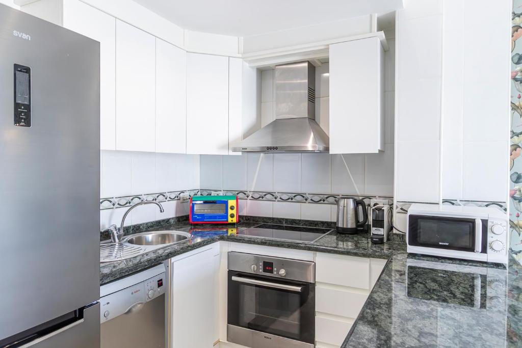 A kitchen or kitchenette at Apartment in beachfront complex in El Duque area, Costa Adeje