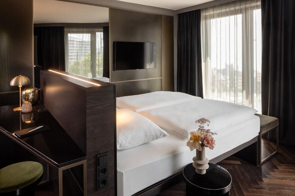 Postel nebo postele na pokoji v ubytování Hotel ROMY by AMANO