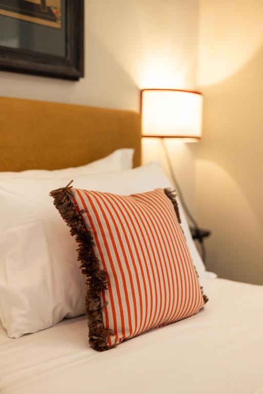 Postel nebo postele na pokoji v ubytování Boutique Hotel Hugo