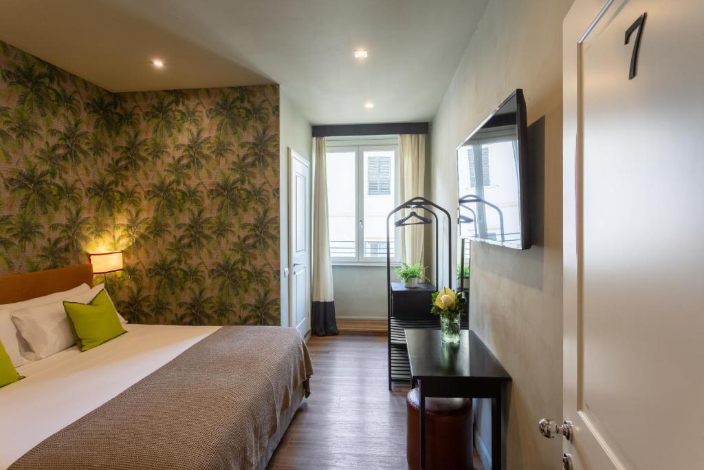 Postel nebo postele na pokoji v ubytování Boutique Hotel Hugo