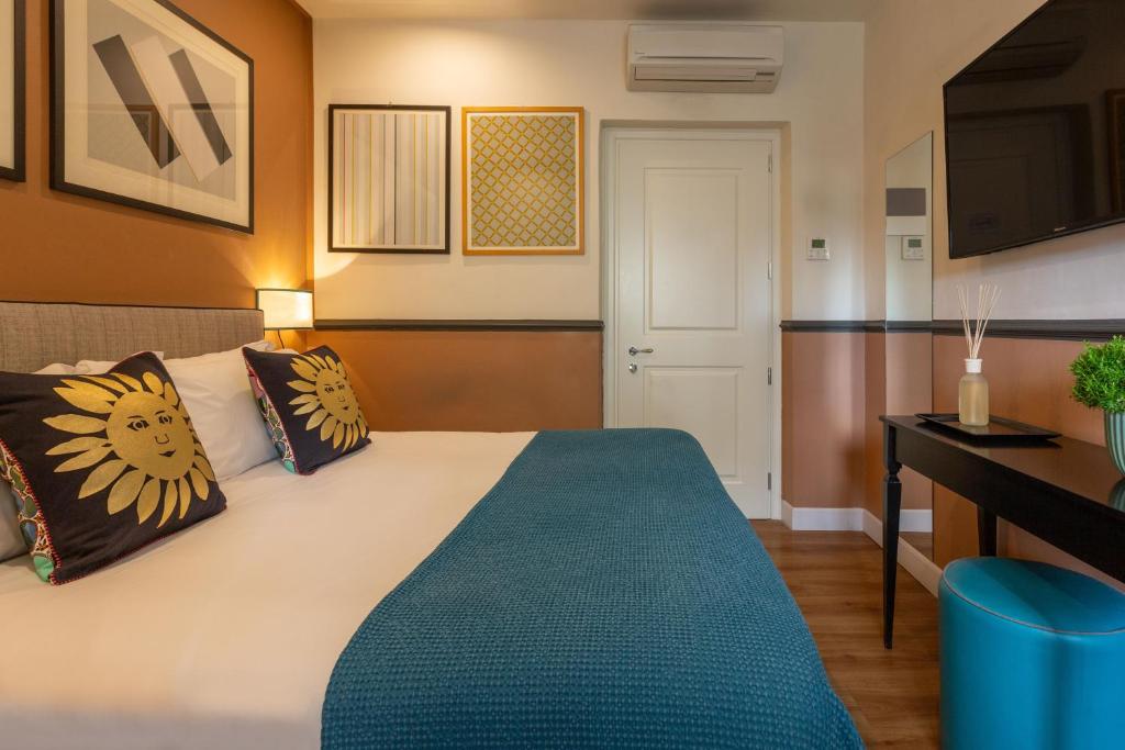 Postel nebo postele na pokoji v ubytování Boutique Hotel Hugo