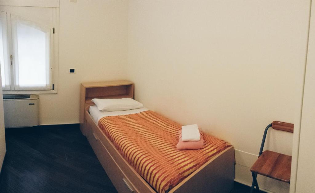 A bed or beds in a room at IL CASTELLO HOSTEL BOUTIQUE