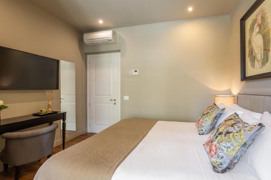 Postel nebo postele na pokoji v ubytování Boutique Hotel Hugo