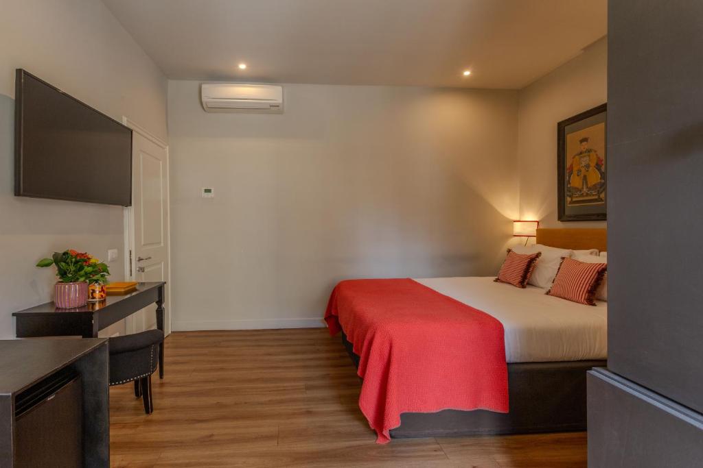 Postel nebo postele na pokoji v ubytování Boutique Hotel Hugo
