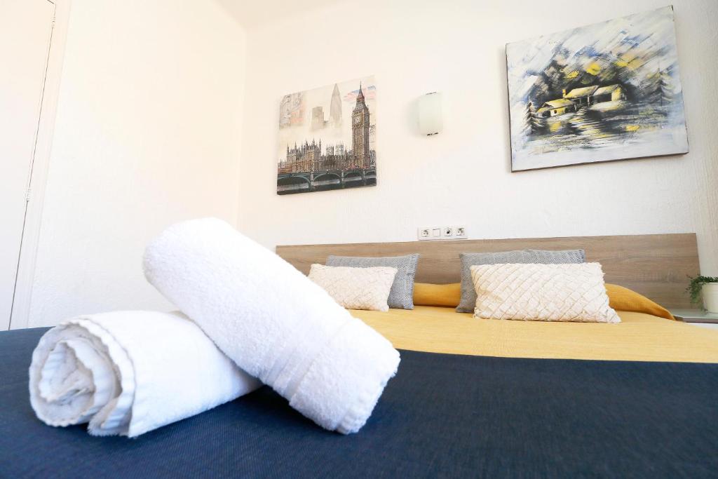 Postel nebo postele na pokoji v ubytování HSR Gil