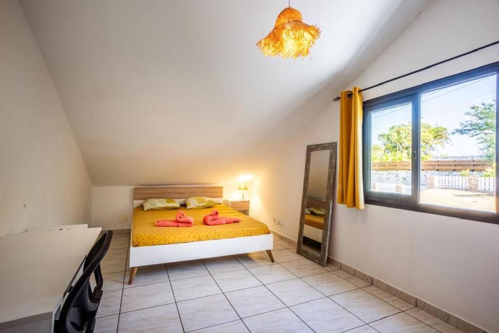 Postel nebo postele na pokoji v ubytování Grande Maison de 8 chambres au sud de"La Réunion"
