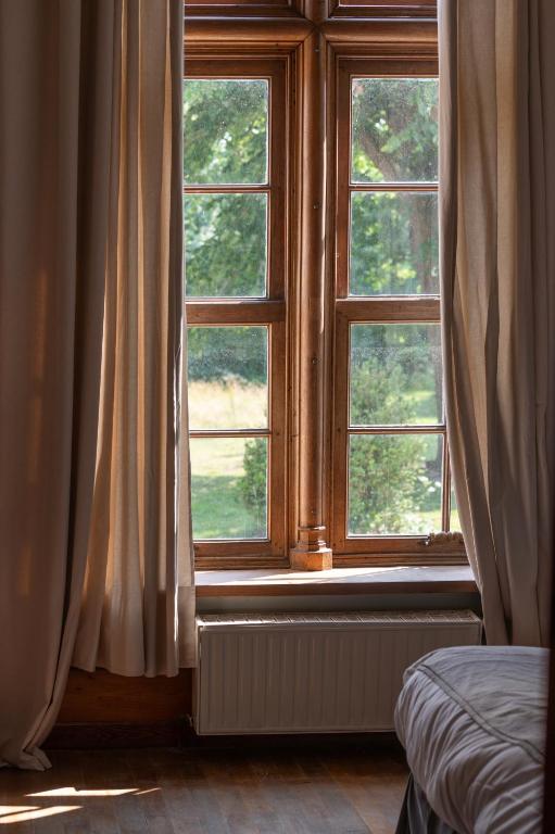 Postel nebo postele na pokoji v ubytování Manoir de la Dune