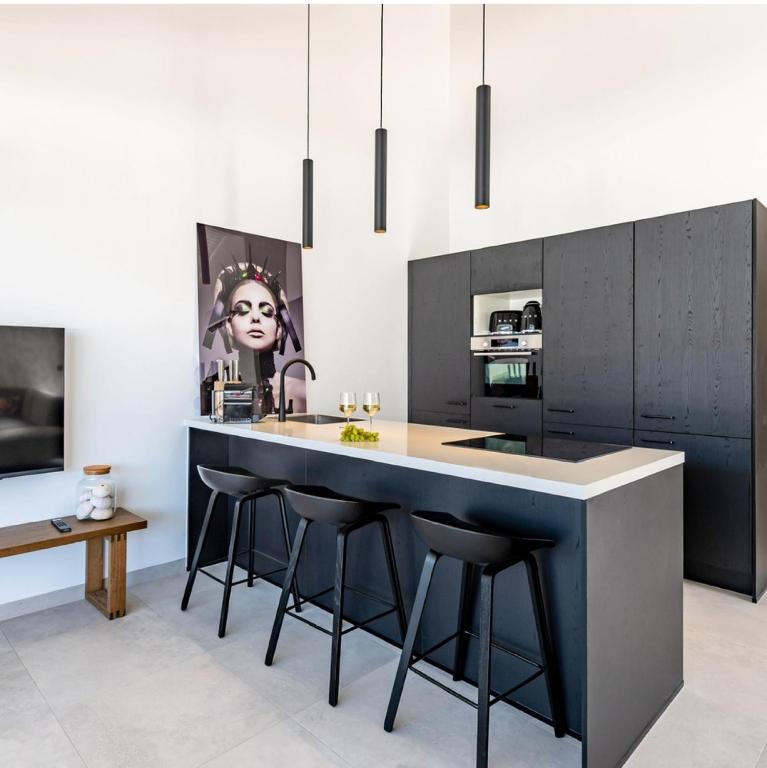 TV a/nebo společenská místnost v ubytování Penthouse Mesa Bonita