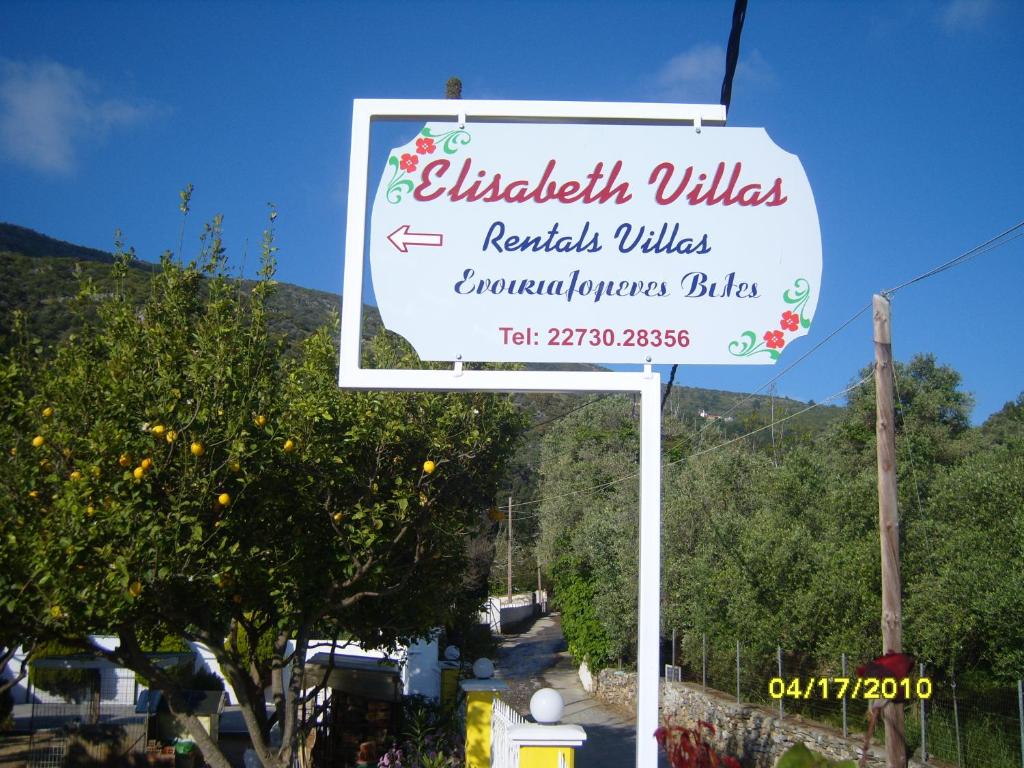 a sign for a restaurant on a street at Elisabeth Villas in Kerveli