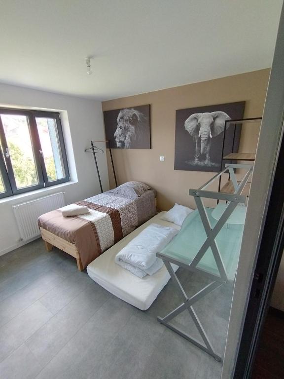 Postel nebo postele na pokoji v ubytování La colloc rue des bulles