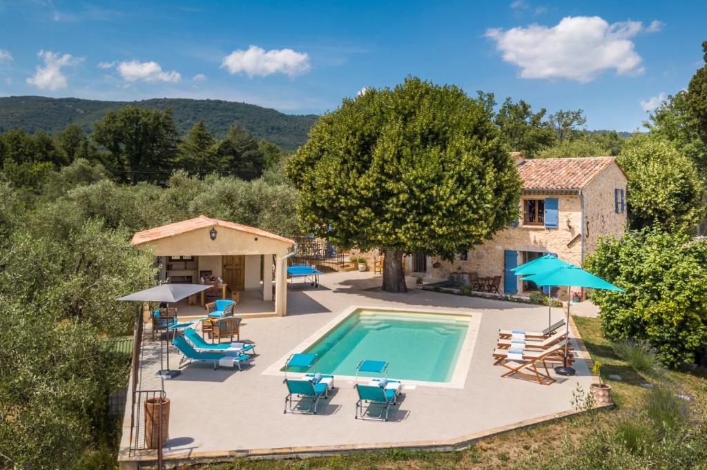 an aerial view of a villa with a swimming pool at Villa La Bergerie by Villa Plus in Saint-Cézaire-sur-Siagne