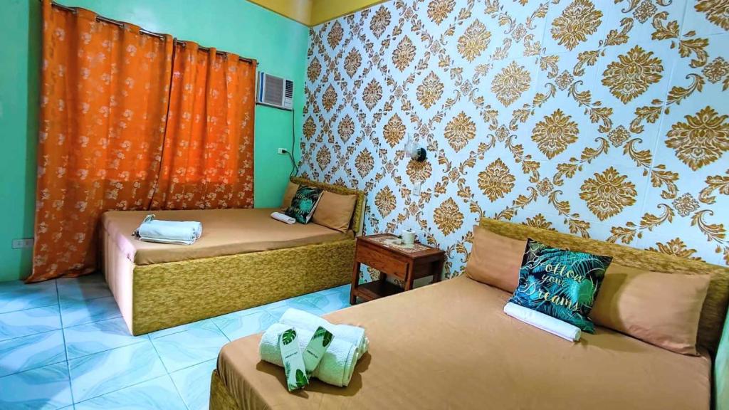 Postel nebo postele na pokoji v ubytování Emshienell Beach Resort and Event Place