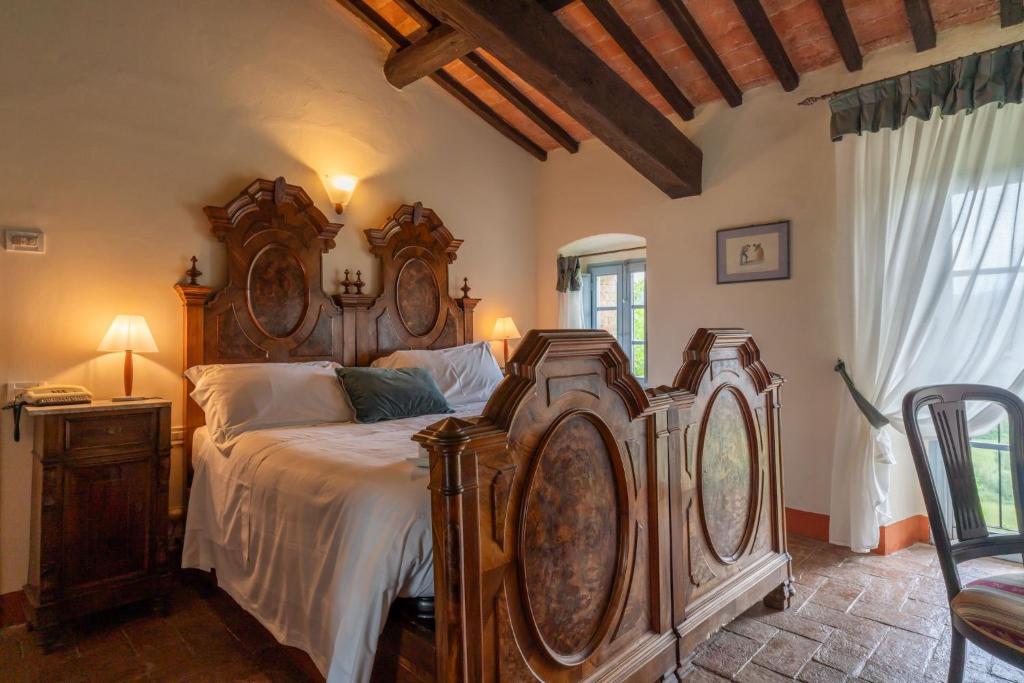Postel nebo postele na pokoji v ubytování Relais CastelBigozzi