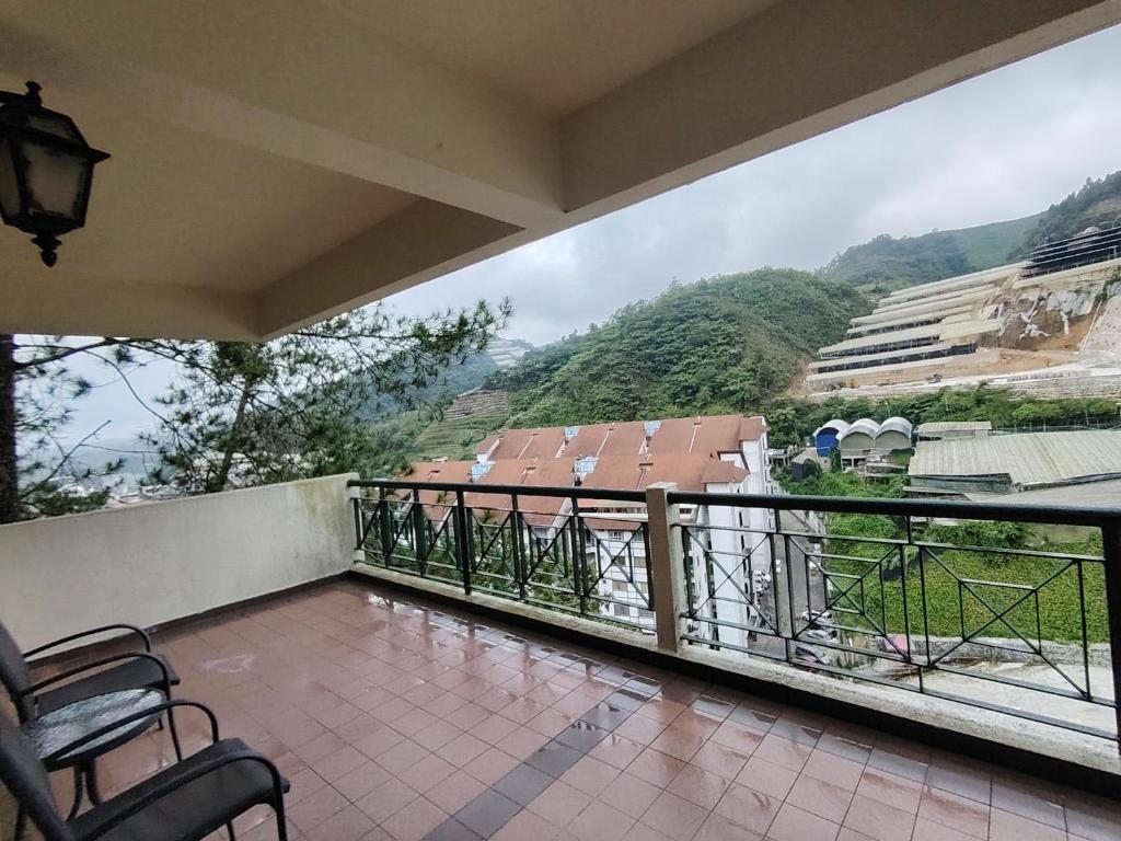 a balcony with a view of a mountain at Highland Hideaway 1 Bedroom Apartment at Equatorial Hill Resort in Brinchang