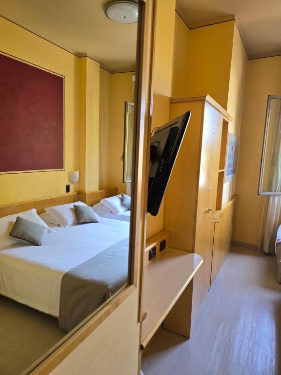 Posteľ alebo postele v izbe v ubytovaní Mokinba Hotels Sant'Ambroeus
