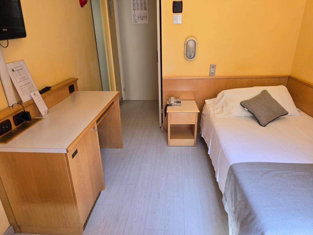 Posteľ alebo postele v izbe v ubytovaní Mokinba Hotels Sant'Ambroeus