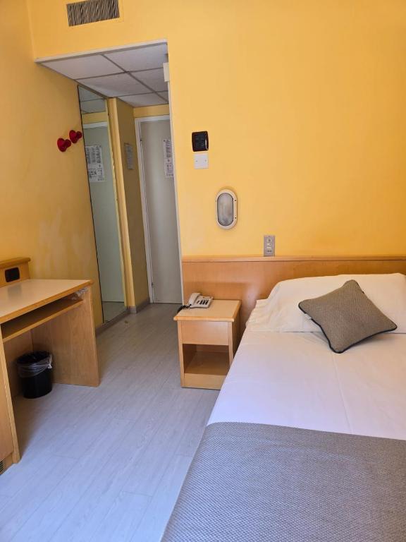 Posteľ alebo postele v izbe v ubytovaní Mokinba Hotels Sant'Ambroeus