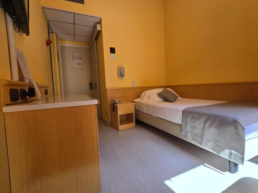 Posteľ alebo postele v izbe v ubytovaní Mokinba Hotels Sant'Ambroeus