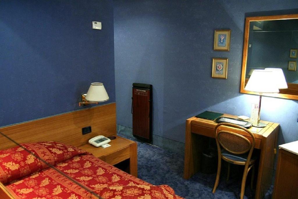 Postel nebo postele na pokoji v ubytování LH Hotel Andreotti