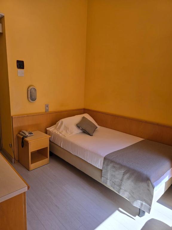 Posteľ alebo postele v izbe v ubytovaní Mokinba Hotels Sant'Ambroeus