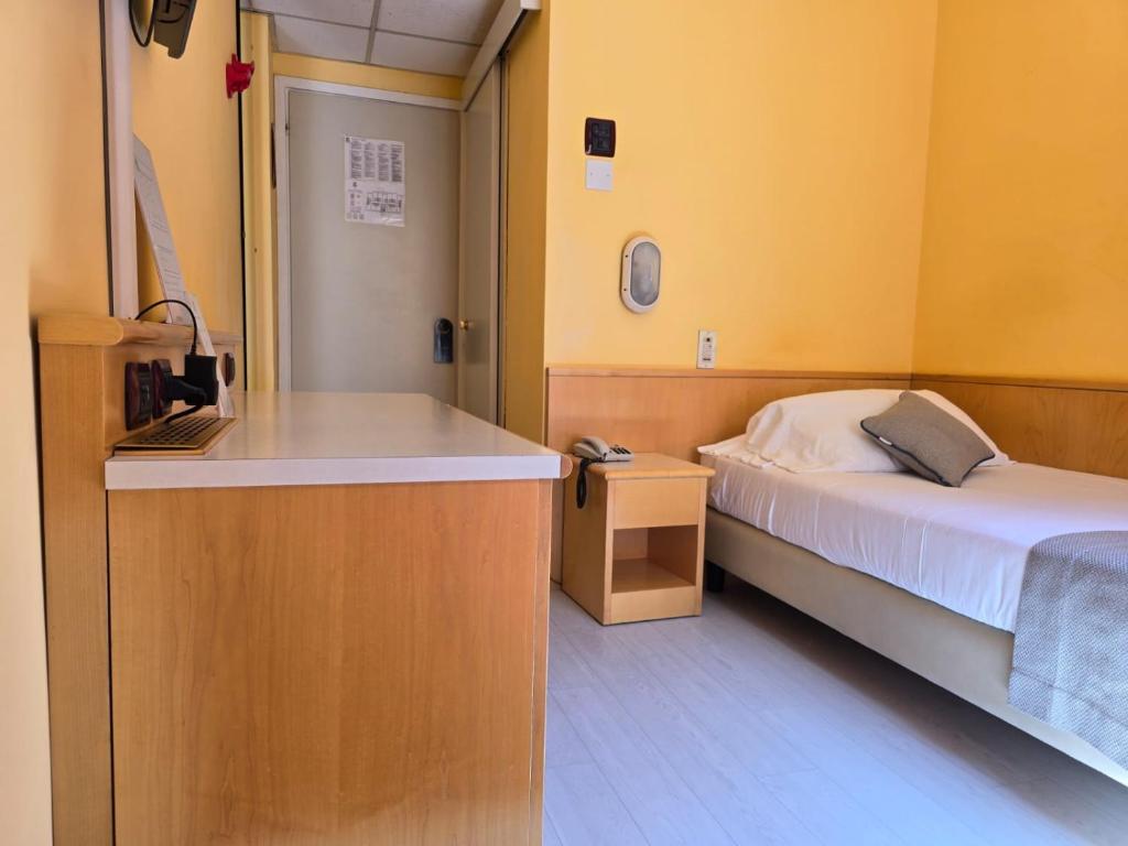 Posteľ alebo postele v izbe v ubytovaní Mokinba Hotels Sant'Ambroeus