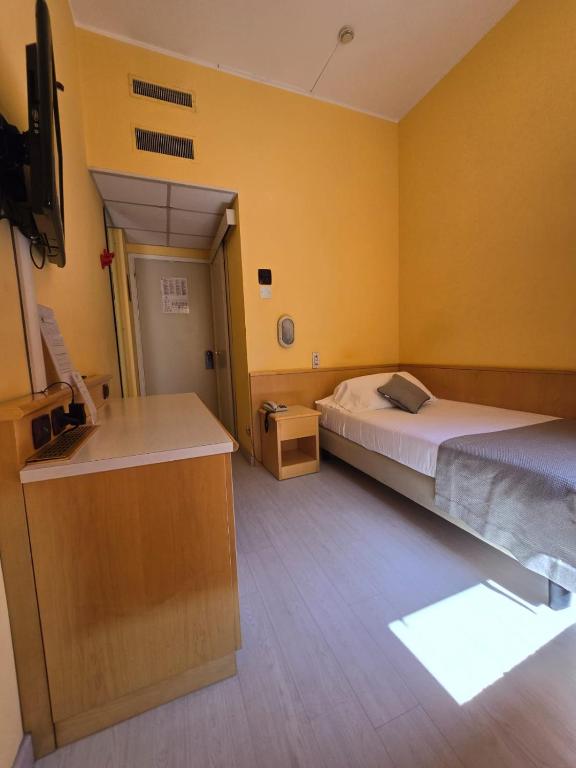 Posteľ alebo postele v izbe v ubytovaní Mokinba Hotels Sant'Ambroeus