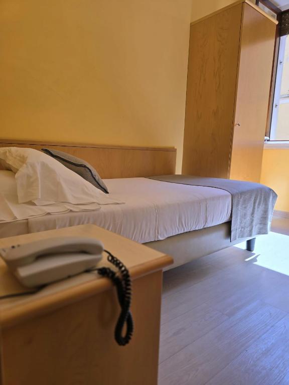 Posteľ alebo postele v izbe v ubytovaní Mokinba Hotels Sant'Ambroeus