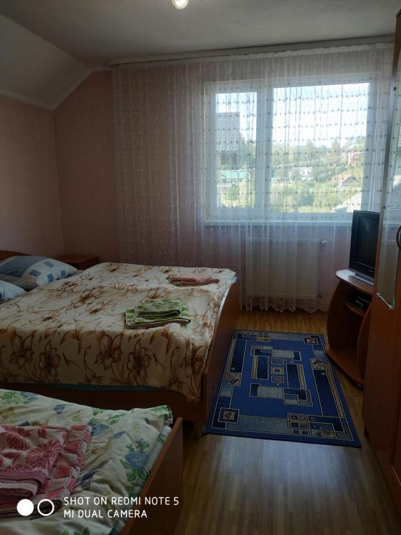 Postel nebo postele na pokoji v ubytování У Галини