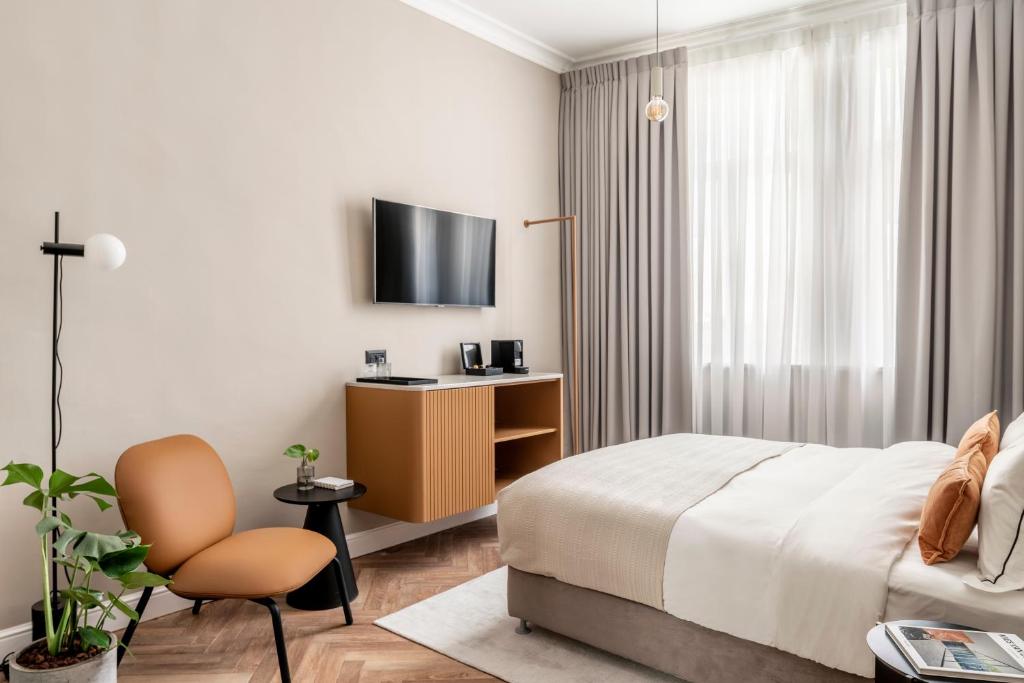 TV a/nebo společenská místnost v ubytování Noel Suites