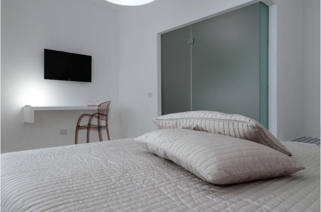 Postel nebo postele na pokoji v ubytování Vittoria Design Hotel di Luce Hotels