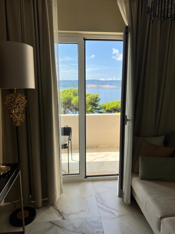 a hotel room with a view of the ocean at LIZA I Sea View in Lokva Rogoznica