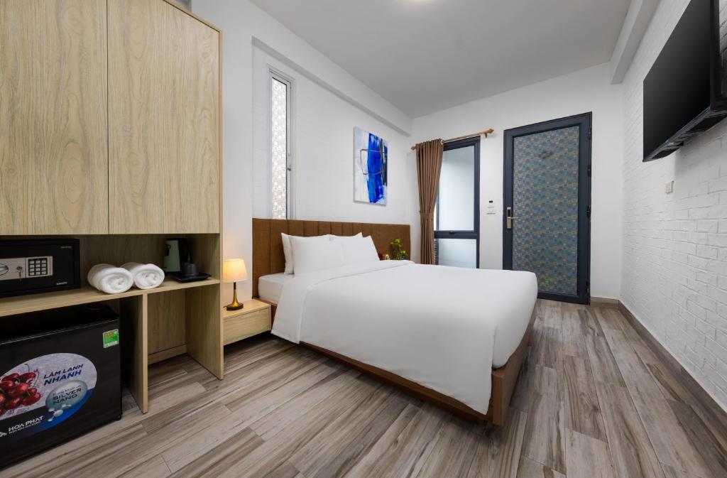 Postel nebo postele na pokoji v ubytování Hanoi Center View Hotel and Spa