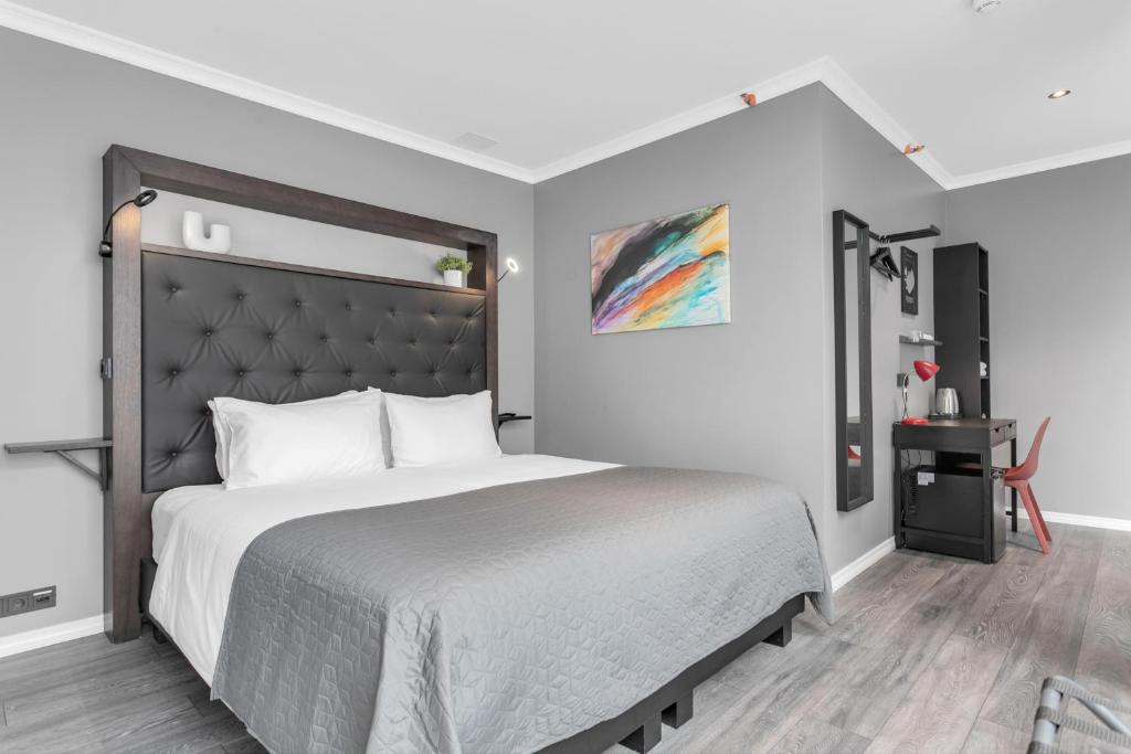 Postel nebo postele na pokoji v ubytování Hotel Aska
