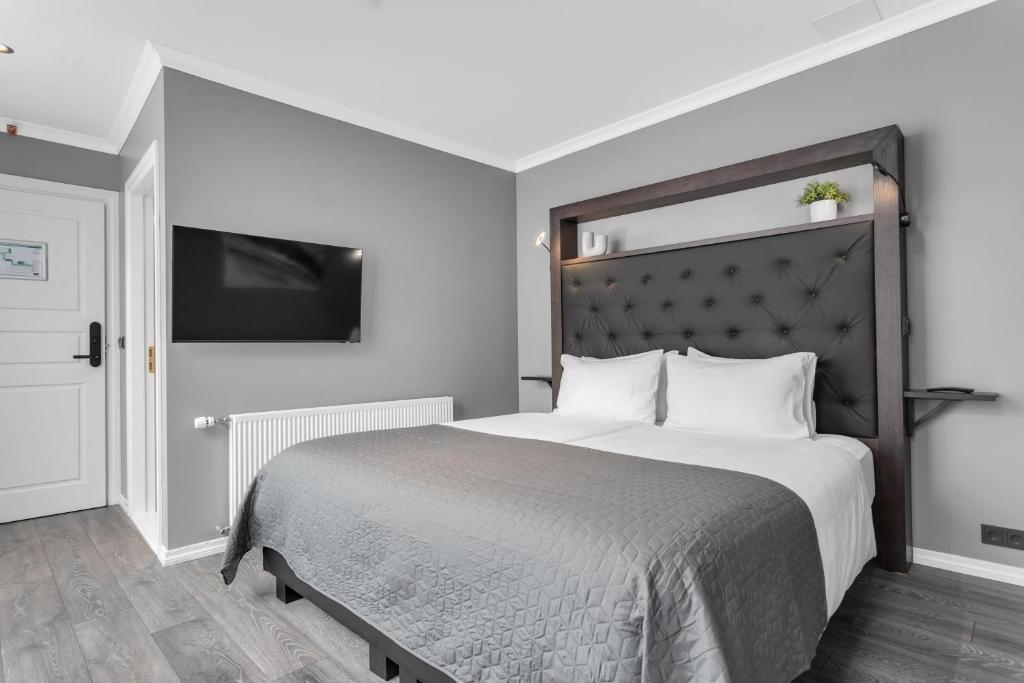 Postel nebo postele na pokoji v ubytování Hotel Aska