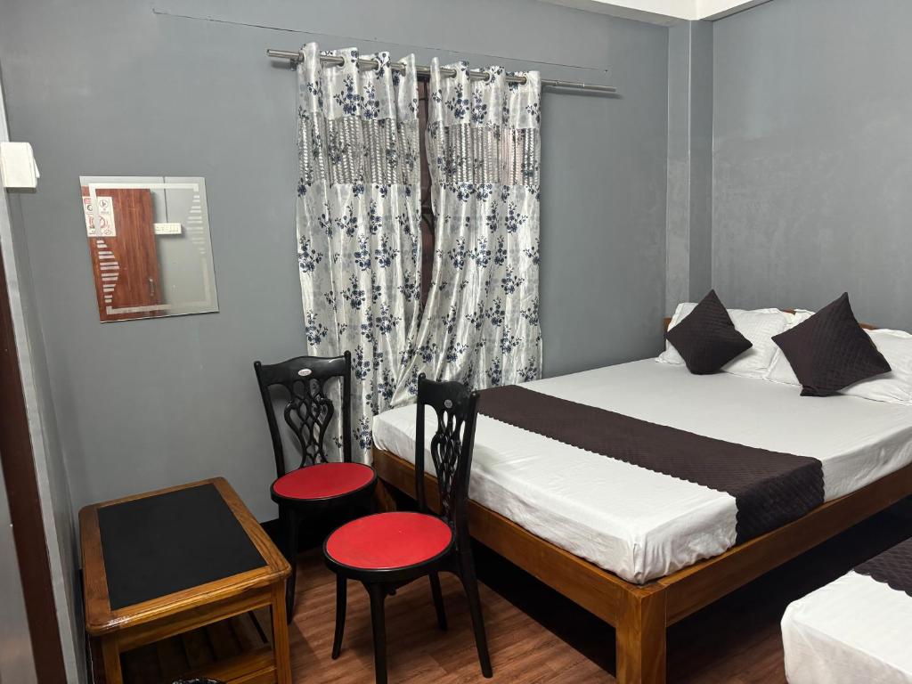 Postel nebo postele na pokoji v ubytování Aama Home Stay