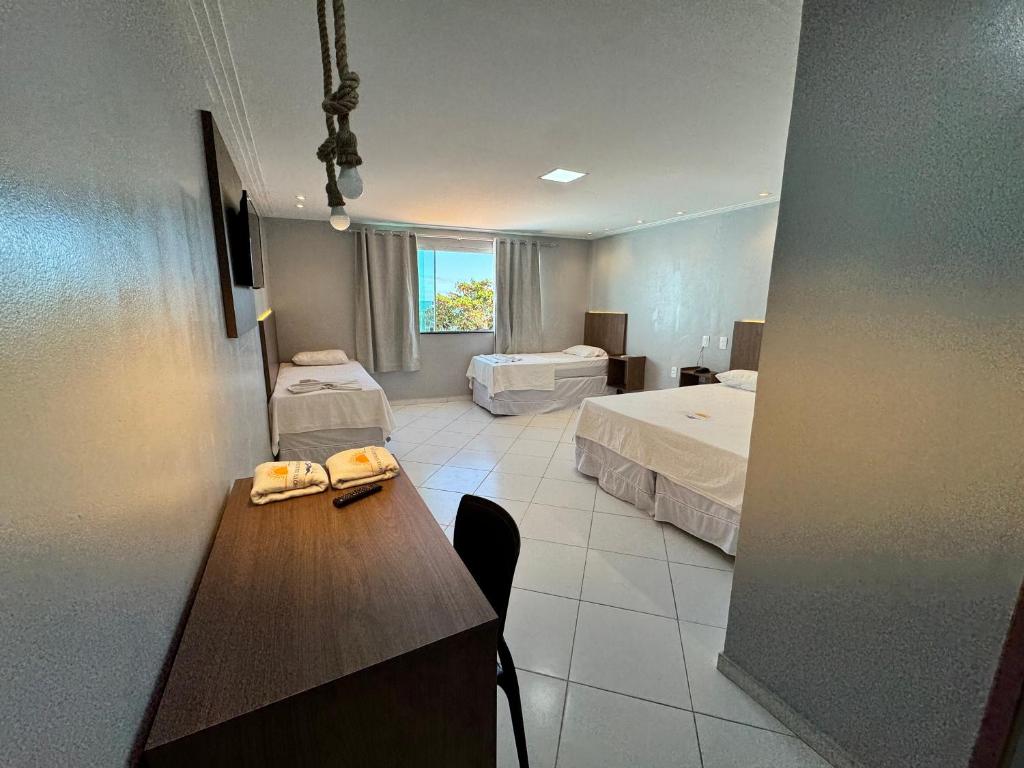 Postel nebo postele na pokoji v ubytování Hotel Luar de Itapua