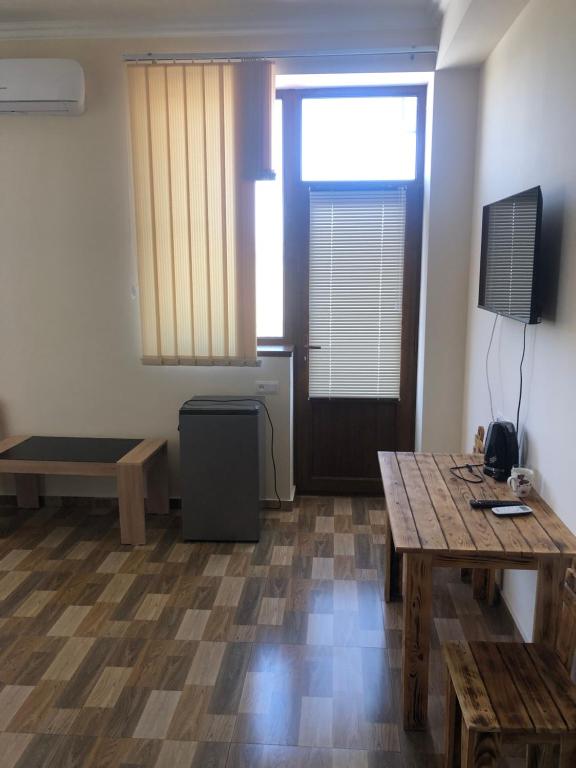 TV a/nebo společenská místnost v ubytování Nigatun Hotel