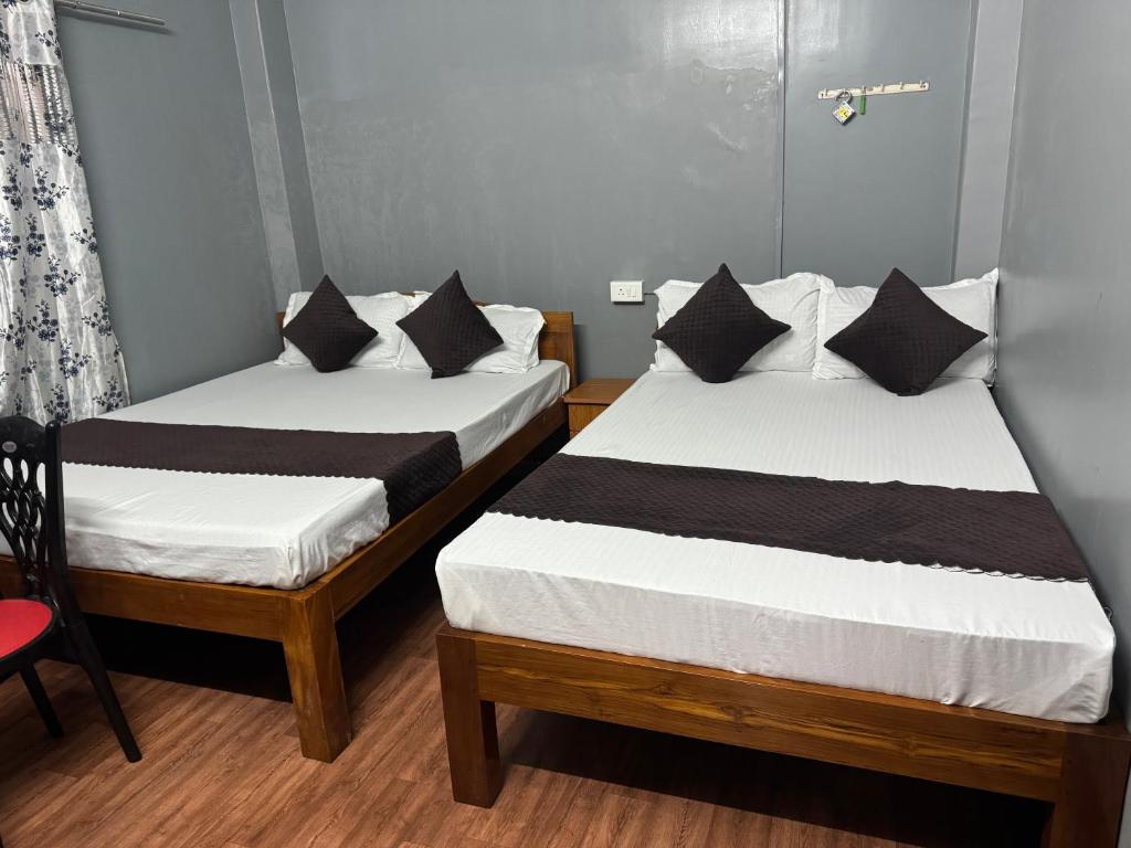 Postel nebo postele na pokoji v ubytování Aama Home Stay