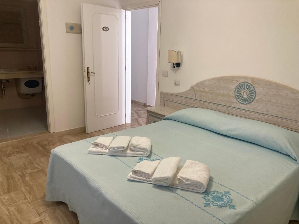 Postel nebo postele na pokoji v ubytování Hotel Villa Campana