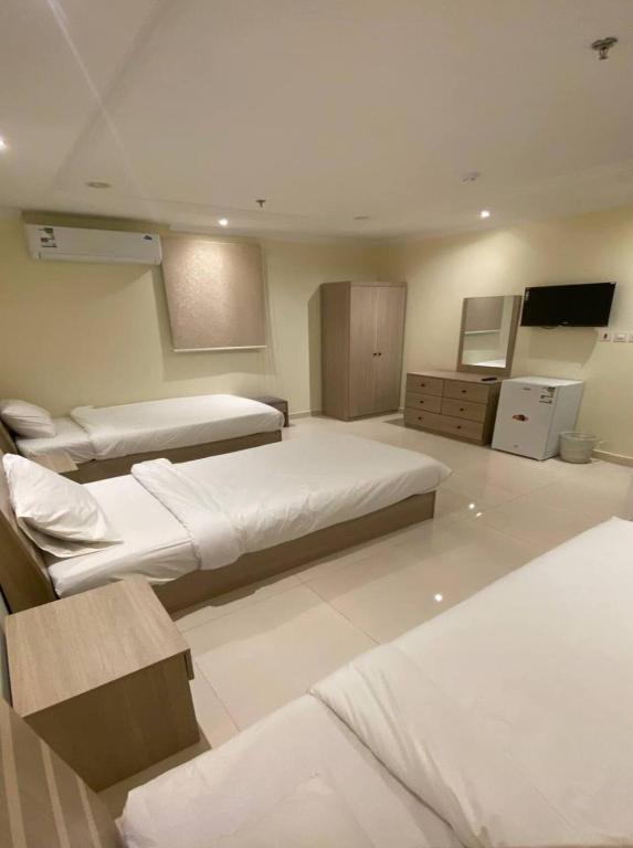Postel nebo postele na pokoji v ubytování Al tawfeeg hotel - Al Azizyah
