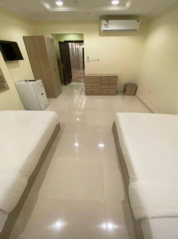 Posezení v ubytování Al tawfeeg hotel - Al Azizyah