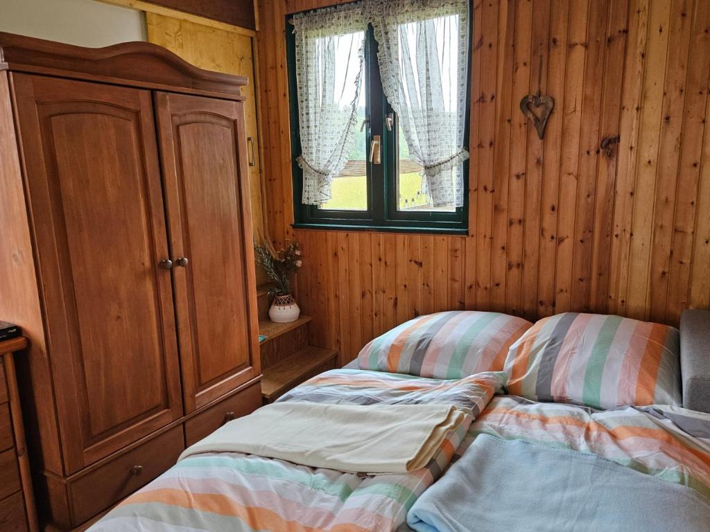 Postel nebo postele na pokoji v ubytování Kleine Jagdhütte