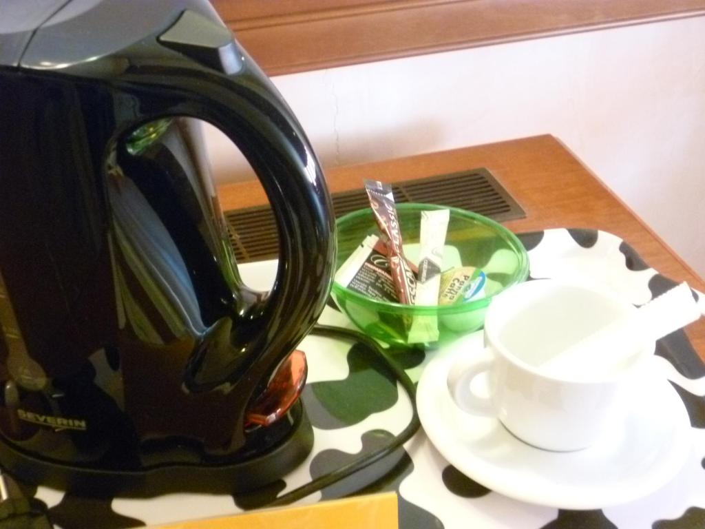 Příslušenství pro přípravu čaje a kávy v ubytování Hotel Minerva