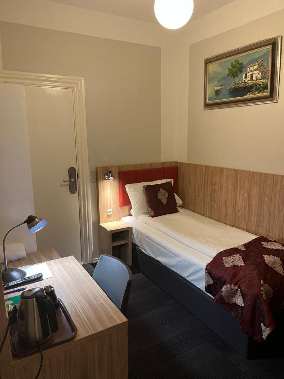 Postel nebo postele na pokoji v ubytování Hotel Skandia