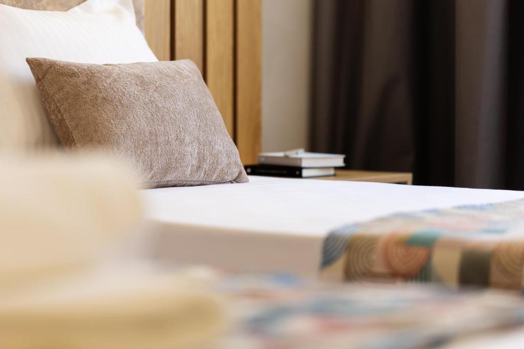 Postel nebo postele na pokoji v ubytování AMAR Design Hotel by HMG