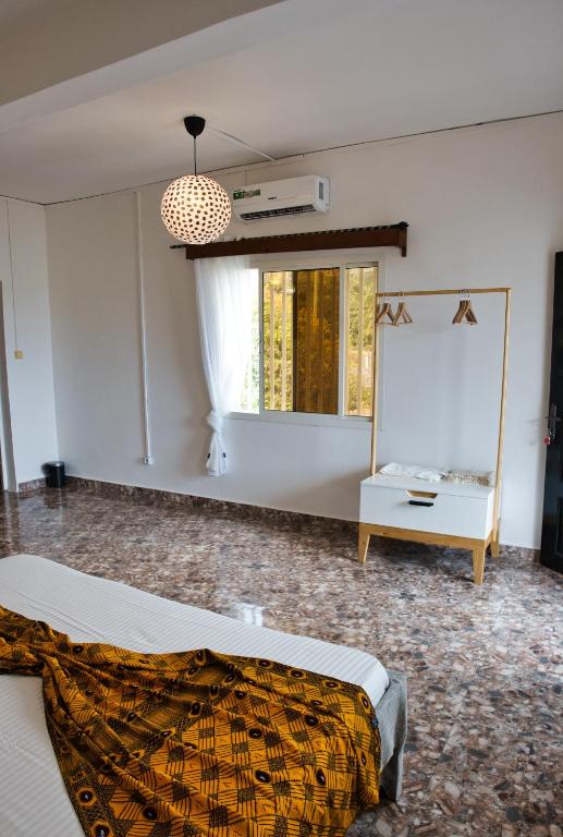 Postel nebo postele na pokoji v ubytování Suite meublée Anzah