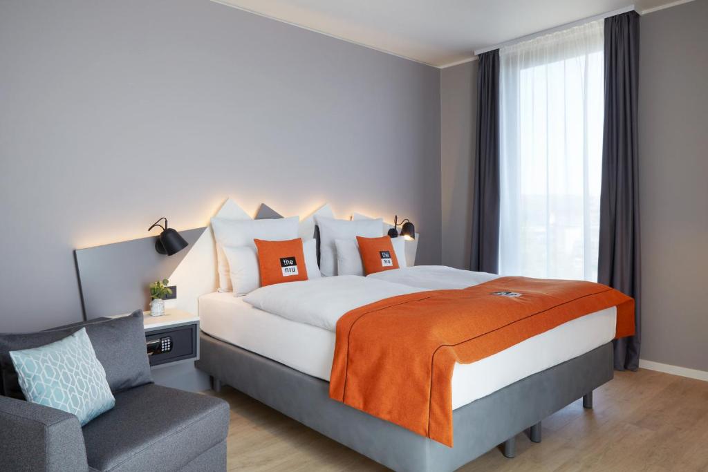 Postel nebo postele na pokoji v ubytování Holiday Inn - the niu, Hub Dusseldorf Messe by IHG
