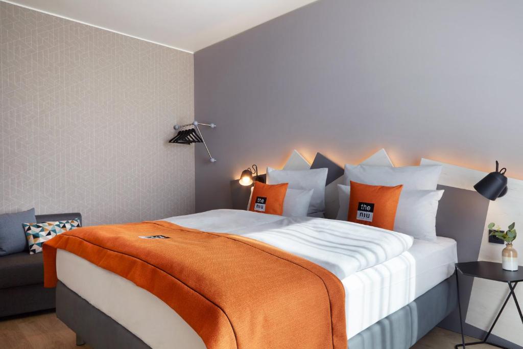 Postel nebo postele na pokoji v ubytování Holiday Inn - the niu, Hub Dusseldorf Messe by IHG