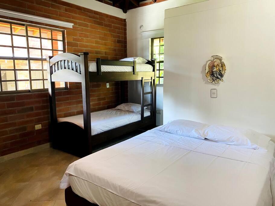 Postel nebo postele na pokoji v ubytování Finca con Piscina y Jacuzzi Privado